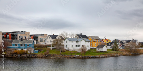 Fotografie Small wooden houses by the sea in Brønnøysund, Nordland county