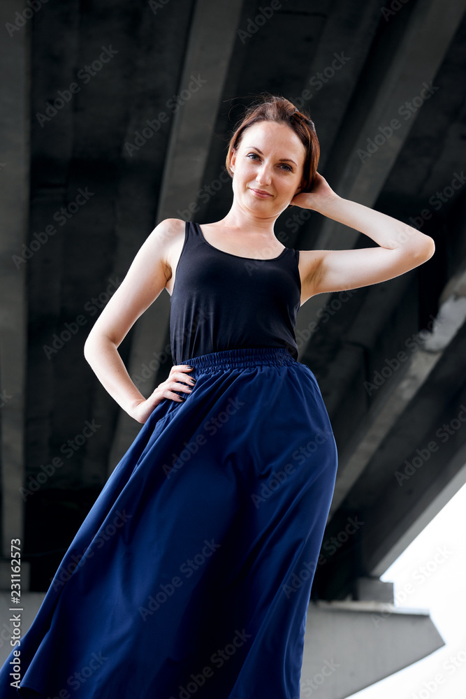 young girl posing under the bridge, dressed in black, modern architecture young girl posing under the bridge, dressed in black, modern architecture
