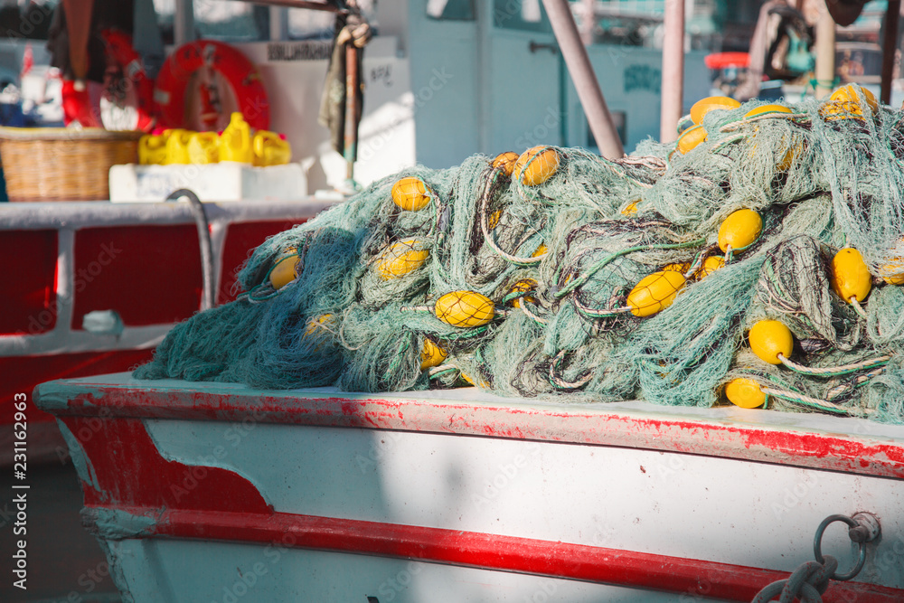 Nylon fishing net with float line attached to small plastic floats on boat  in turkey Stock Photo