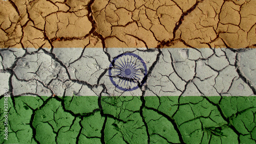 Political Crisis Or Environmental Concept: Mud Cracks With India Flag