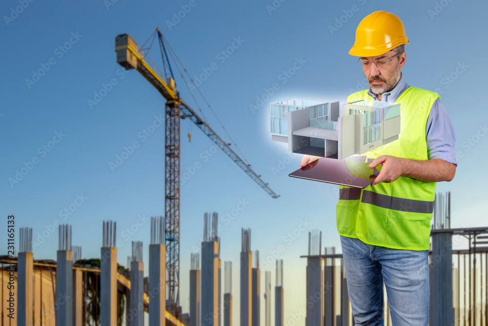 architect in costruction site with tablet displaying a hologram architect in costruction site with tablet displaying a hologram