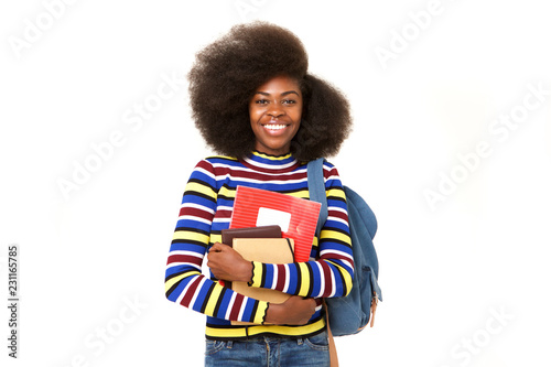 smiling black female college student with books and bag against isolated white background