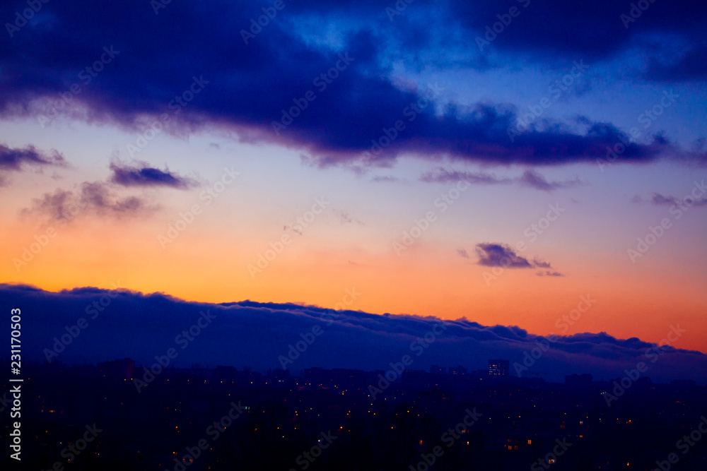 beautiful view on city in the evening and clouds 