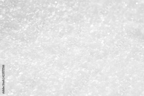 White snow texture  small sparkling snowflakes  macro. Background light gray for the New Year holidays or greeting cards.