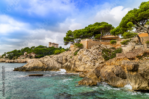 Punta de Cala Gat, with view to Villa March, also palace Sa Torre Cega in Cala Rajada, Capdepera, Mallorca, Balearic Islands, Spain photo