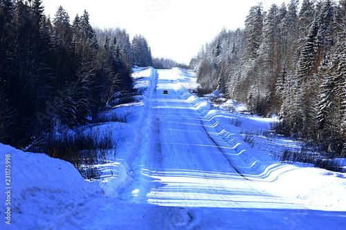 The road through the winter forest