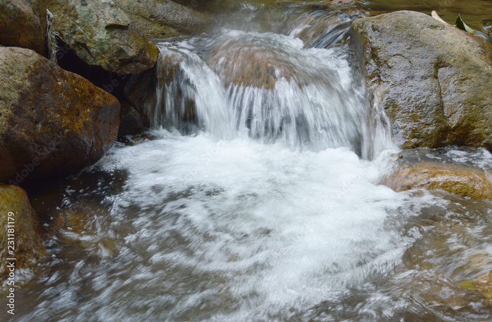 water run through river pass rock and stone in forest water run through river pass rock and stone in forest