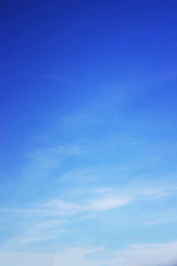Blue sky background and white clouds soft focus, and copy space