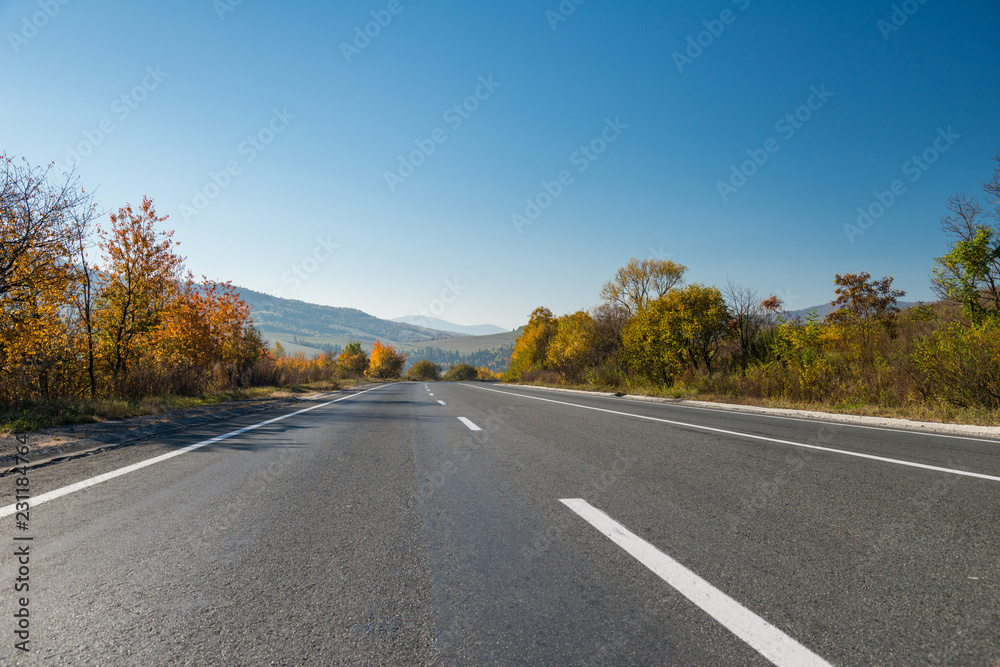 Empty road in autumn mountains