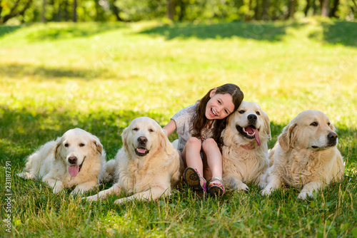Little girl and four dogs