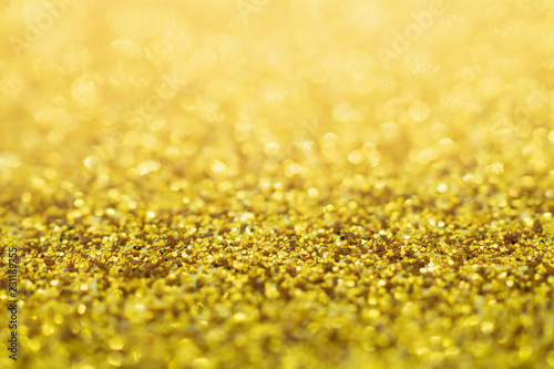 Abstract Gold glitter festive Christmas texture background blur with bokeh light