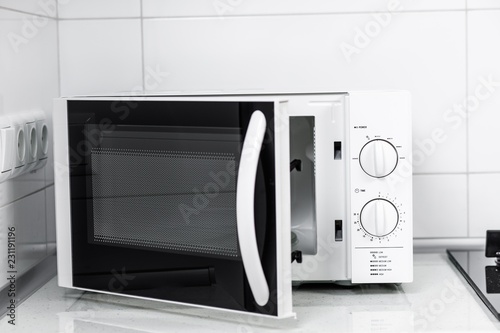 Image of the microwave oven. Modern microwave. Front view. photo
