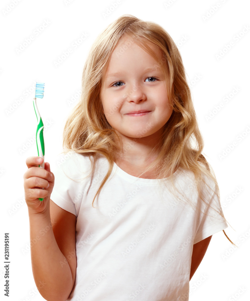 A little kid girl is brushing her teeth with a toothbrush. The concept of daily hygiene. Isolated on white background A little kid girl is brushing her teeth with a toothbrush. The concept of daily hygiene. Isolated on white background
