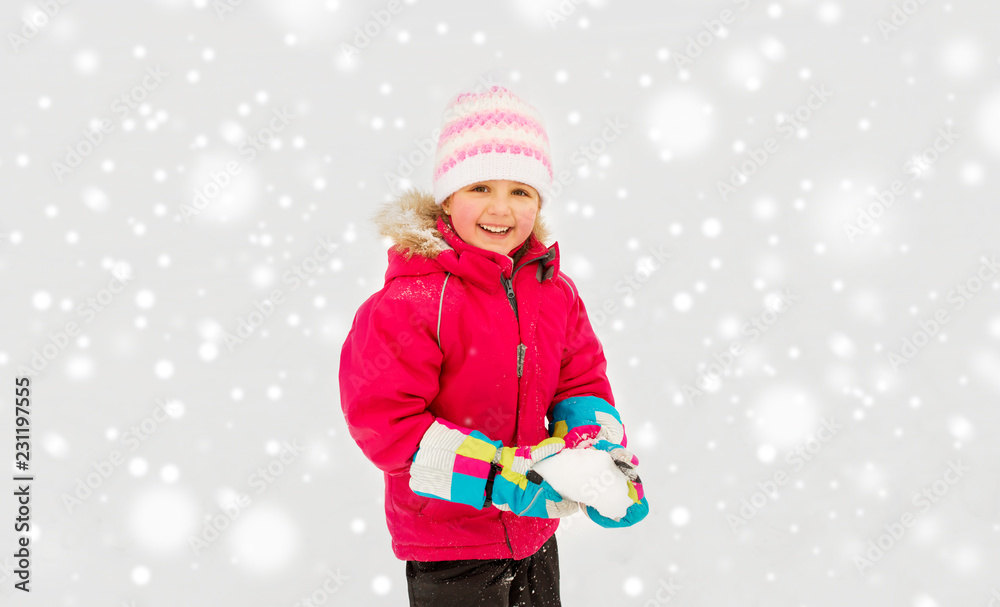 childhood, leisure and season concept - happy little girl playing with snow in winter childhood, leisure and season concept - happy little girl playing with snow in winter