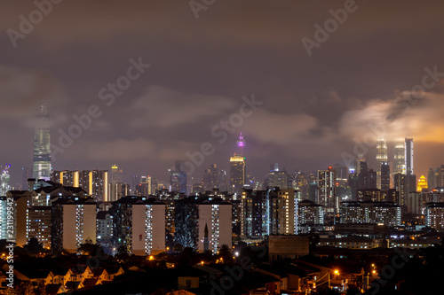 Photography Cloudy night landscape over downtown Kuala Lumpur, Malaysia.