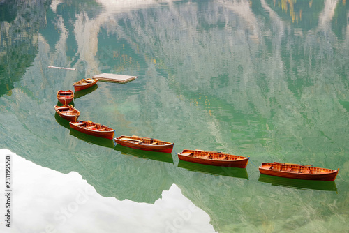 Lago di Braies. Lake Braies (Lago di Braies) in Dolomites Mountains. Boats on the Braies Lake ( Pragser Wildsee ) in Dolomites mountains, Sudtirol, Italy, Europe. Beautiful lake in the italian alps. 