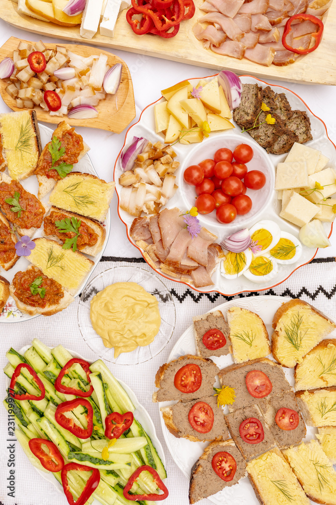 Table filled with traditional food from Romania and Moldova at a brunch