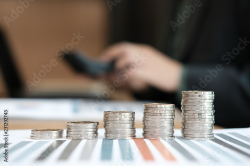 coins stack & business growth. businessman working