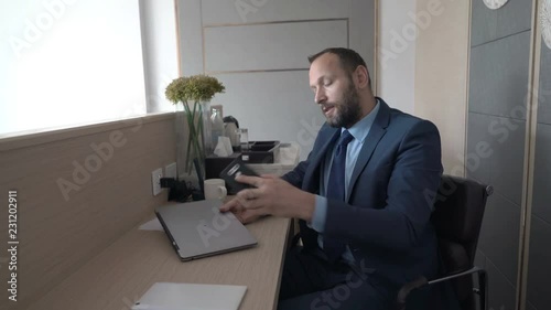 Businessman finsihes workn at his office and leaves it photo