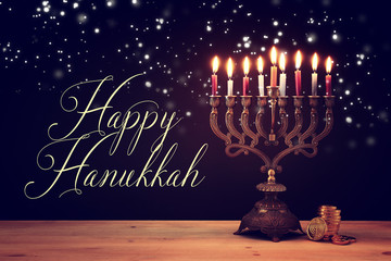 image of jewish holiday Hanukkah background with menorah (traditional candelabra) and candles.