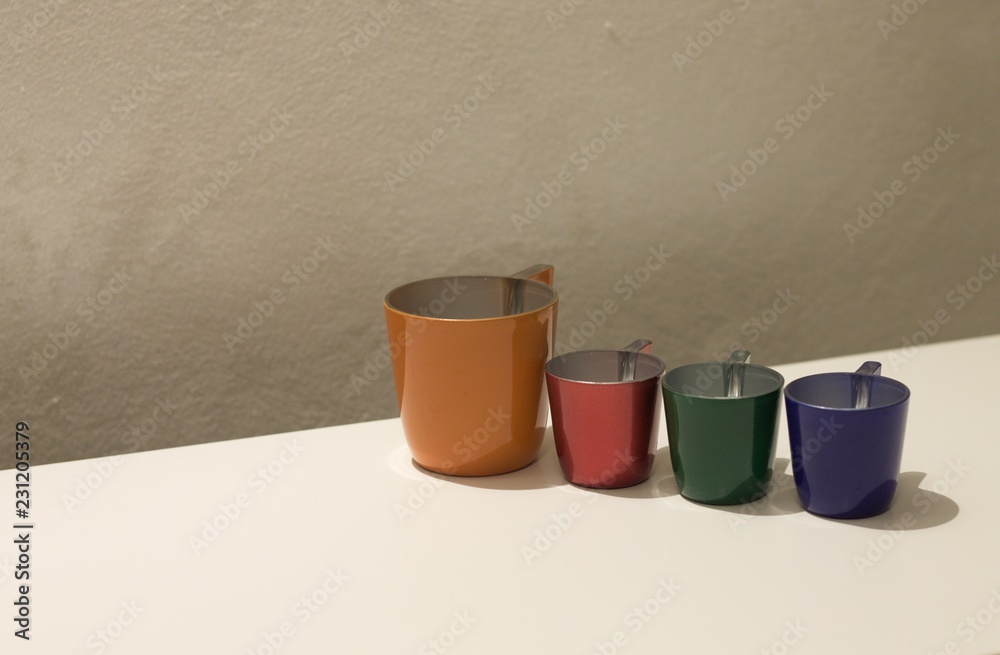 Four colored coffee cups on a white table (Pesaro, Italy, Europe) Four colored coffee cups on a white table (Pesaro, Italy, Europe)