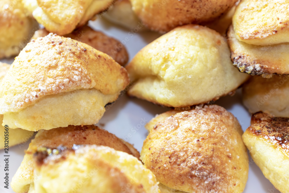 Many tasty homemade cookies on a plate close up