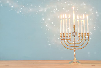 image of jewish holiday Hanukkah background with menorah (traditional candelabra) and candles.