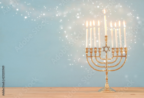 image of jewish holiday Hanukkah background with menorah (traditional candelabra) and candles.