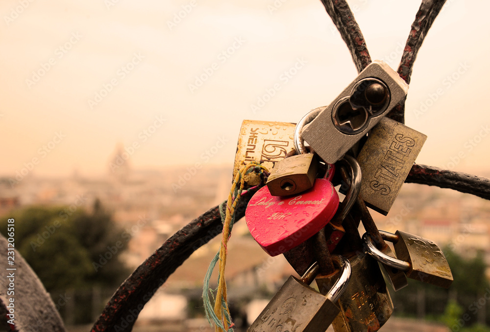 Rome, Italy - October 12, 2018: Lovers padlocks on a bridge. View from the Pincian hill in Rome, Italy Rome, Italy - October 12, 2018: Lovers padlocks on a bridge. View from the Pincian hill in Rome, Italy