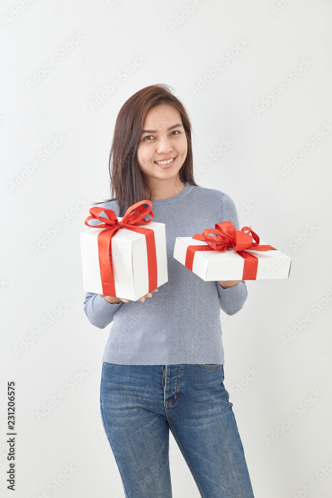 Young woman happy hold gift box in hands Young woman happy hold gift box in hands