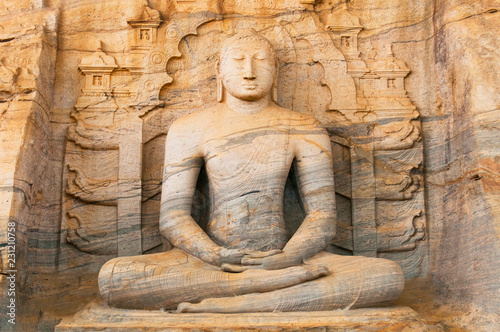 Buddha statue at Gal vihara temple in Polonnaruwa, Sri Lanka. The temple has four rock relief statues of the buddha carved of a large rock.