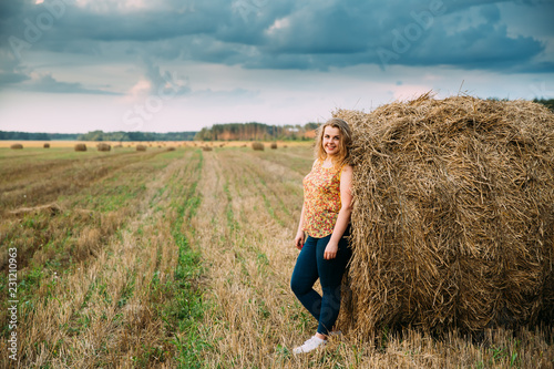 Portrait Beautiful Plus Size Young Woman Standing Near Hay Bale 