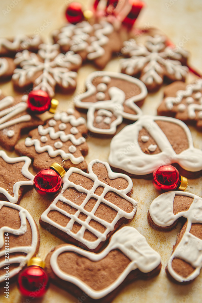 Christmas cookies compostion on table. With small balls. Various shapes on gingerbread biscuits. View from above.