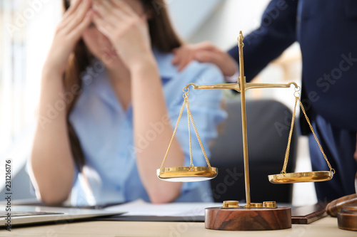 Scales of justice on table ...
