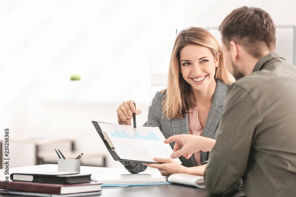 Consulting manager with man at meeting in office Consulting manager with man at meeting in office