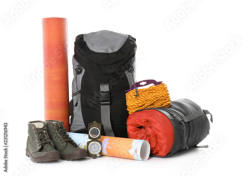 Set of camping equipment with sleeping bag on white background