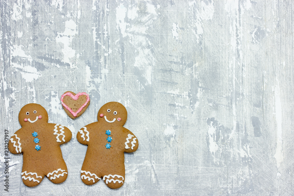 Christmas gingerbread man cookies decorated with icing for new year or christmas party, winter holiday, sweet homemade gift for kids