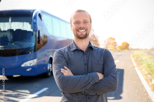 Professional driver standing near bus. Passenger transportation