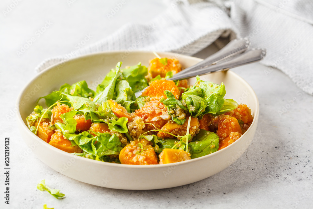 Warm quinoa and pumpkin salad in a white plate. Warm quinoa and pumpkin salad in a white plate.