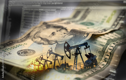 Stock charts and Oil derricks, against the background of a twenty-dollar bill.