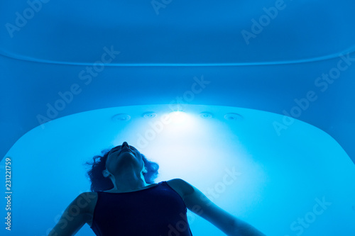 Relaxed woman during sensory deprivation float experience photo