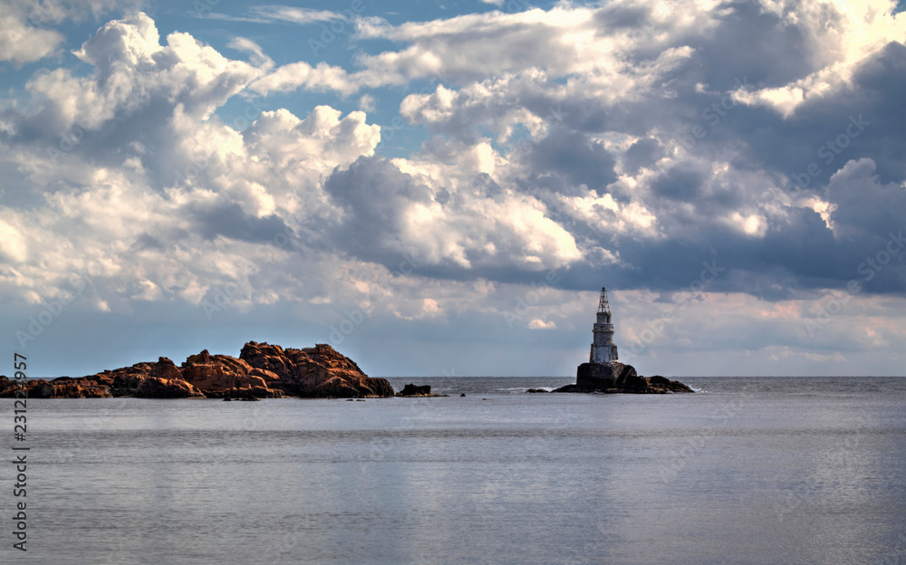 Beautiful landscape with lighthouse and blue sea