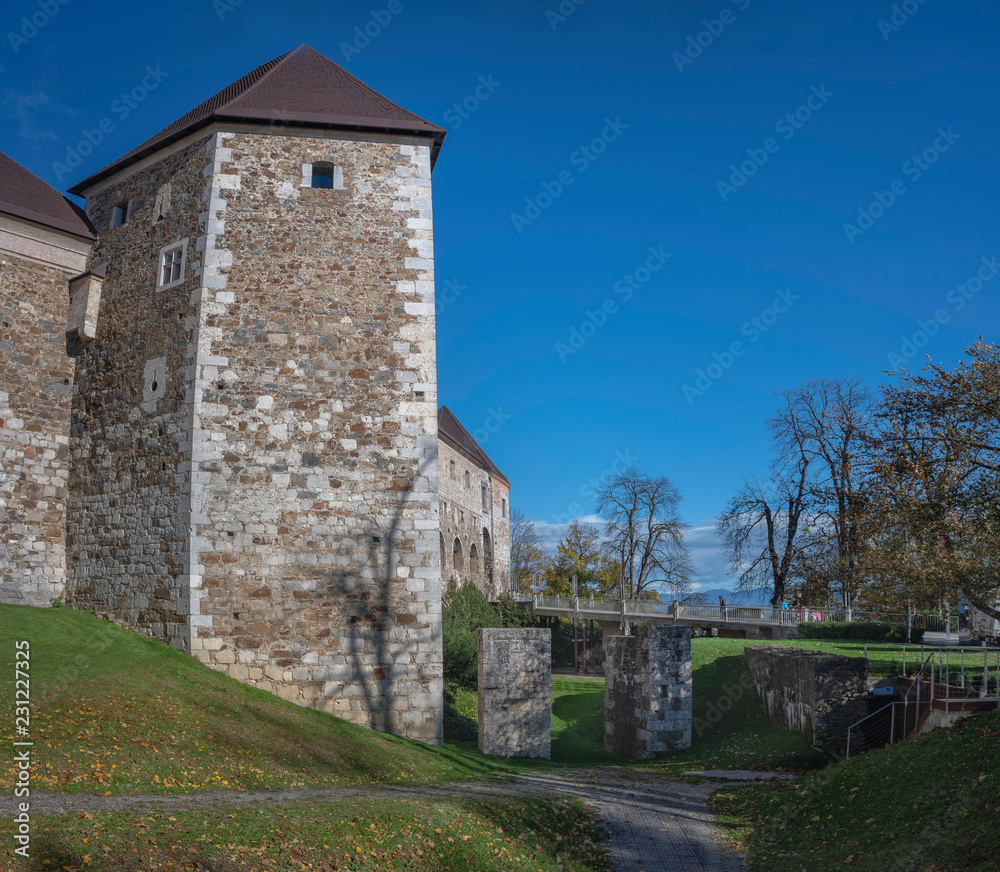 Medieval tower of castle in Ljubljana with defensive ditch and bridge, Slovenia