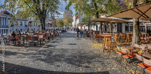  Promenade along river Ljubljanica in Ljubljana with bars in autumn, Slovenia