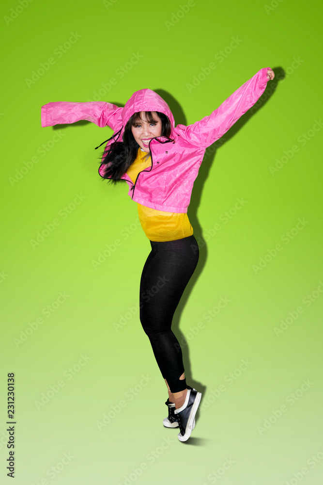 Asian woman doing hip hop dance