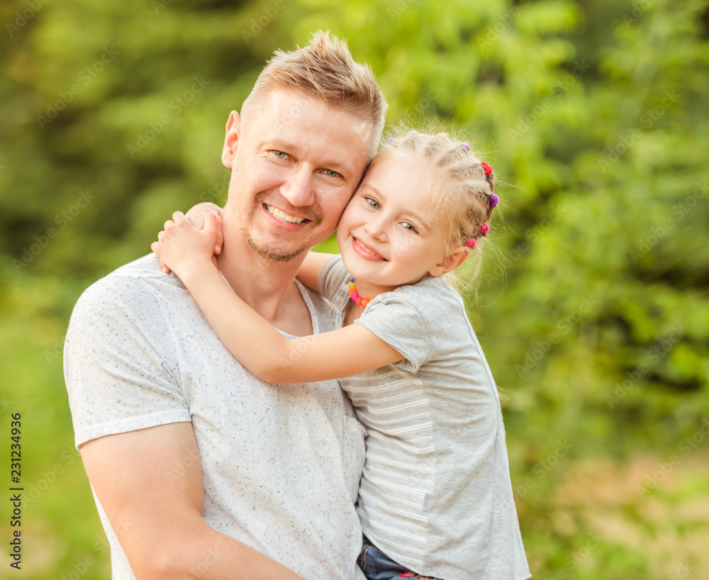 Fototapeta premium Dad holding little daughter
