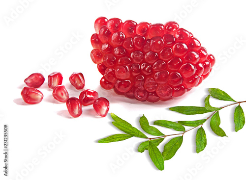 Pomegranate fruit and twig  isolated on white background photo