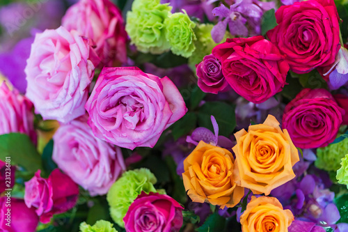 Mixed multi colored roses in floral decor, Colorful wedding flowers background