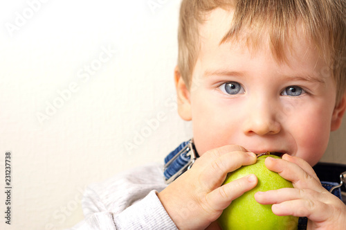 Boy with green apple