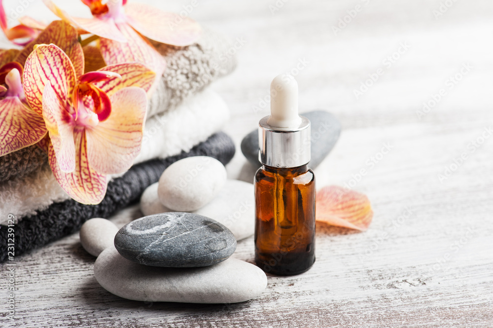 Spa still life with essential oils, pebbles